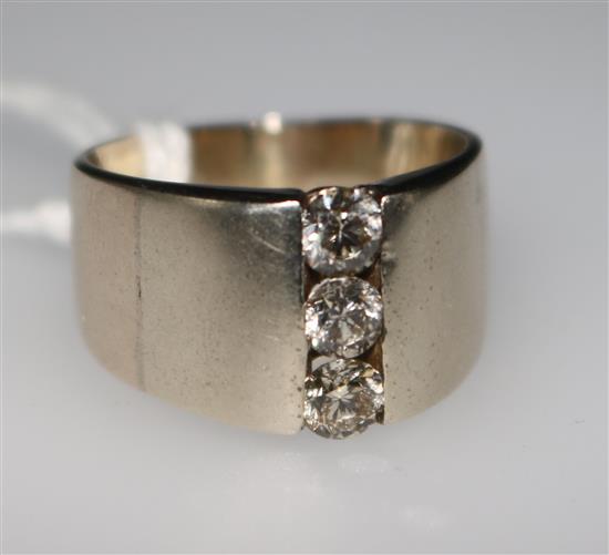 A three stone diamond ring, size N.